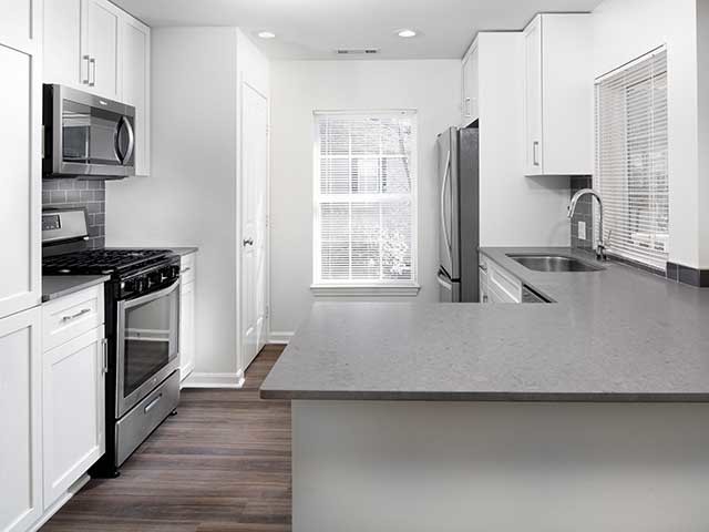 Avalon At Bedford Center Ma Apartment Finder Newly Renovated Kitchen With Quartz Countertops And Hard Surface Plank Flooring In Select Homes
